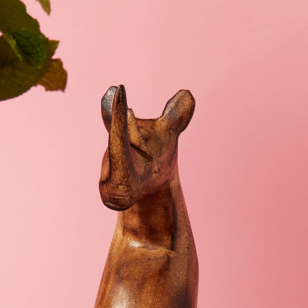 Seared Wood Rhino Sitting Sculpture
